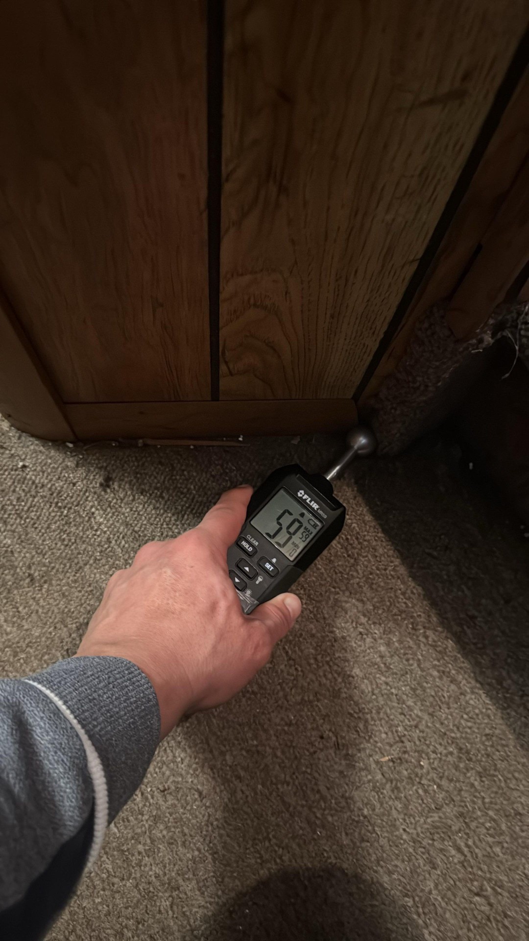 Moisture meter on basement wall