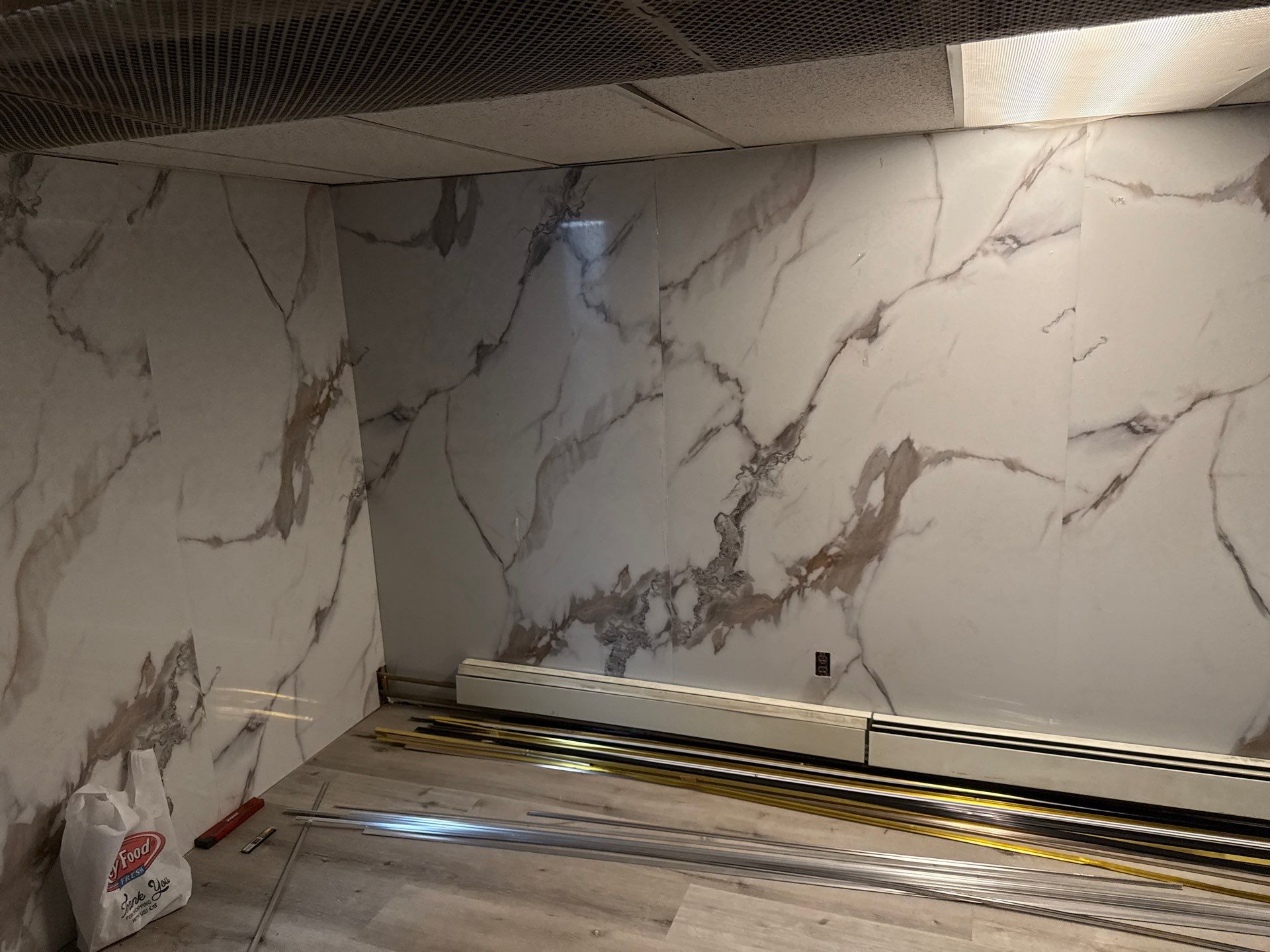 Marble-look wall panels installed