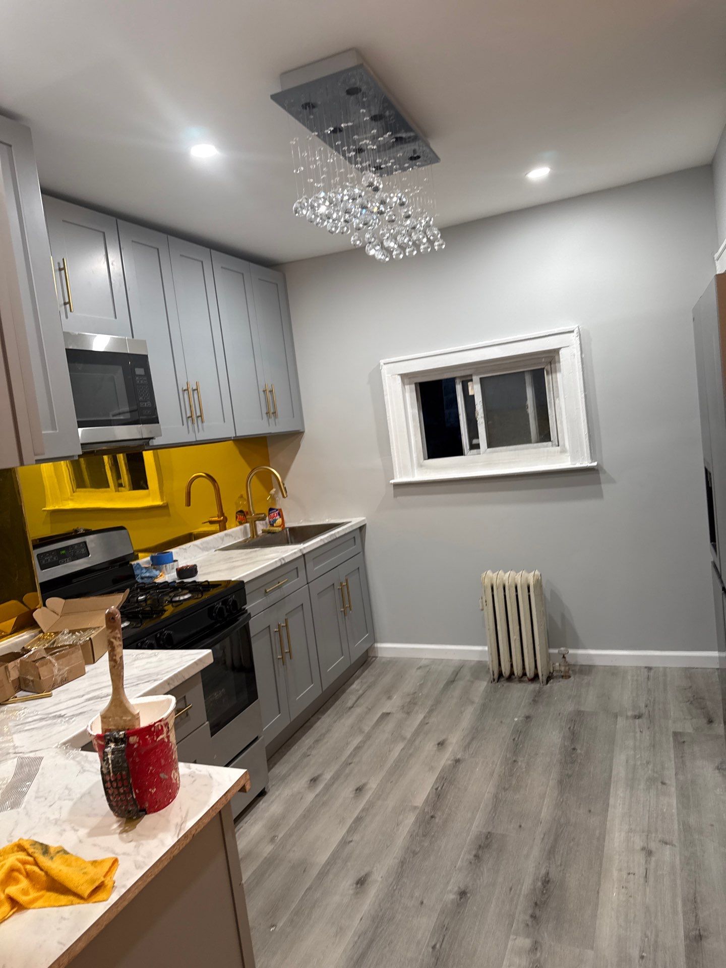 Finished kitchen with chandelier